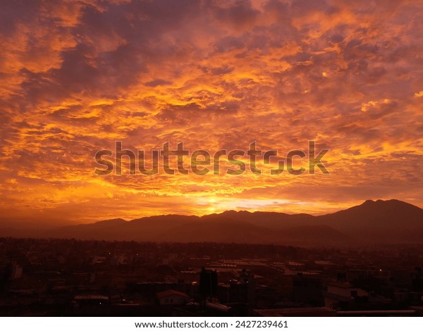 Early morning sunrise with a golden cloud