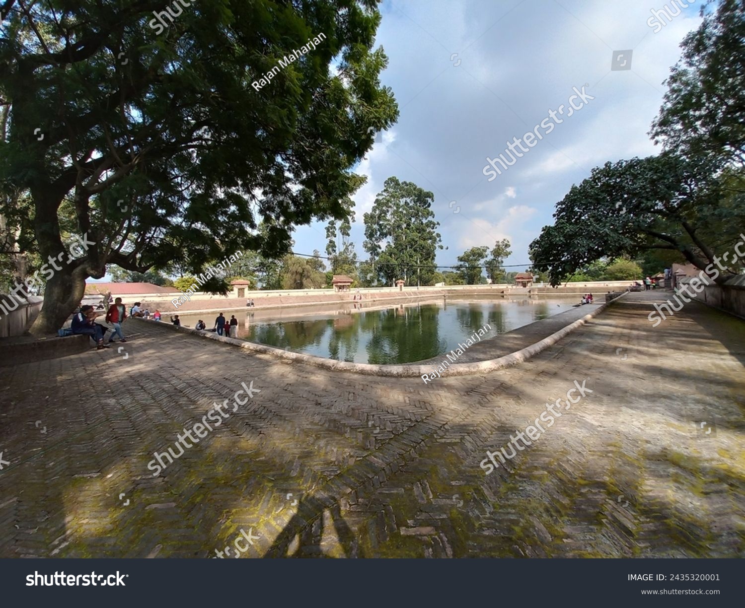 Sky above a quiet pond in the middle of the city